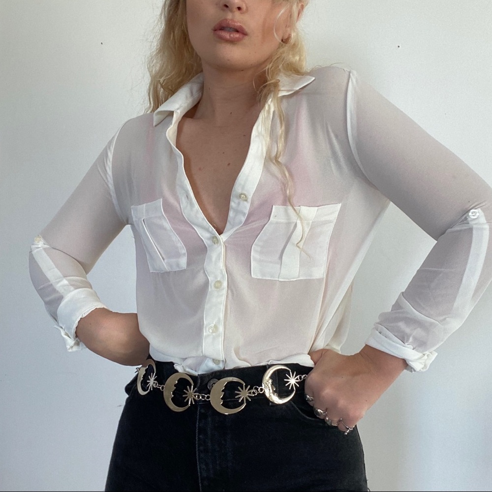 Super chic and and minimal sheer white button up